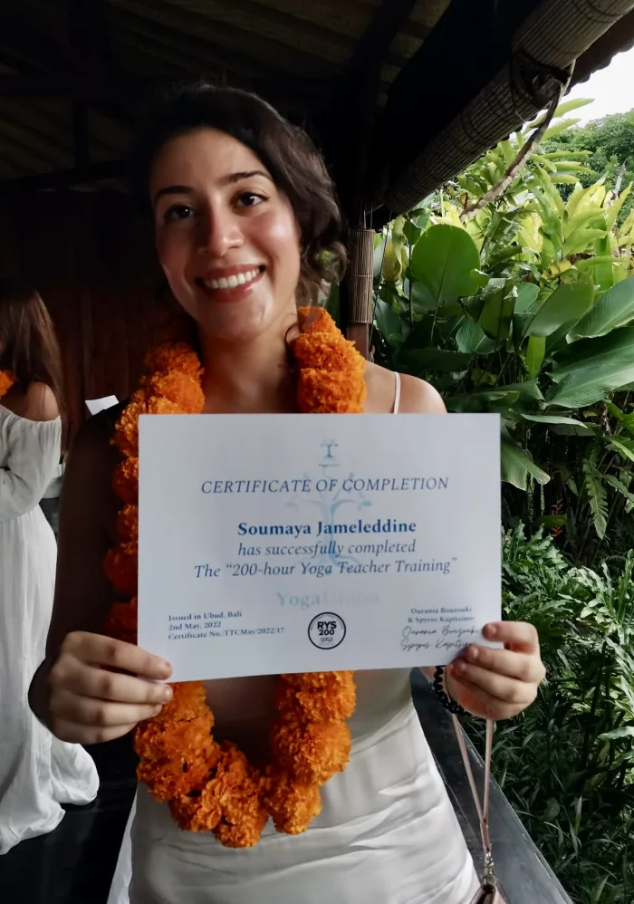 Receiving the 200-hour yoga teacher training certificate in Ubud